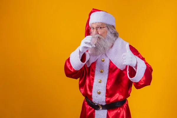 Santa Claus Vodou Žlutém Pozadí — Stock fotografie