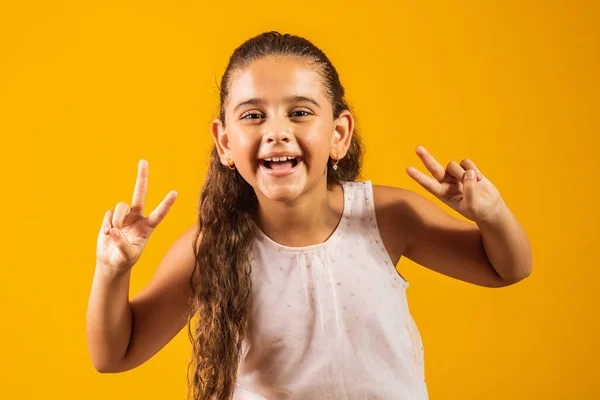 Adorable Little Girl Making Sign Yellow Background Good Vibe Peace — Stock Photo, Image
