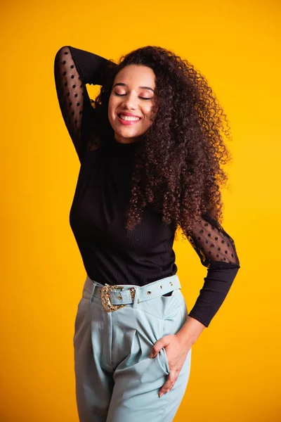 stock image Black skin beauty woman. Afro woman with curly hair on yellow background. black day