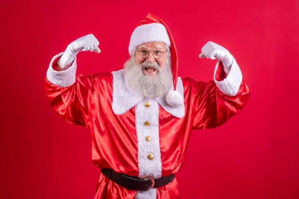 圣诞老人表现出肌肉 强壮的圣诞老人 — 图库照片