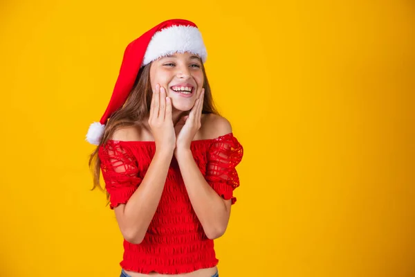 Portrait Caucasian Smiling Girl Santa Hat Yellow Background Christmas Happines — Stock Photo, Image