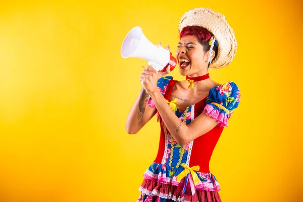 stock image brazilian woman with festa junina clothes. Arraial, Feast of Saint John. with notebook, with megaphone.