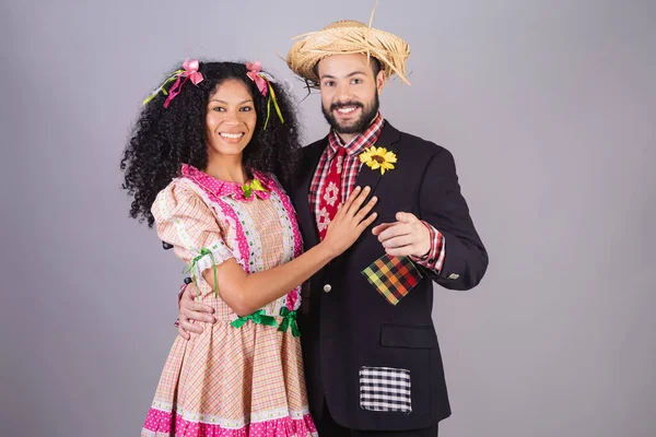 stock image Couple wearing typical clothes of Festa Junina, Arraial, Festa de So Joo. pointing at the camera. 