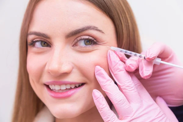 stock image Woman wearing bathrobe in beauty clinic, aesthetics, patient, cosmetic procedures. botox application. anti wrinkle and anti aging.