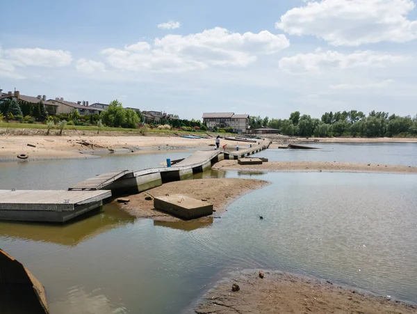 stock image Zaporizhzhia, Ukraine - June 9, 2023: The destruction of the Kakhovka dam led to a catastrophic decrease in the water level in the Dnipro river. A huge environmental disaster is coming