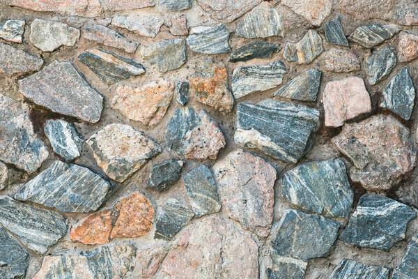 Masonry made of granite stones. Background