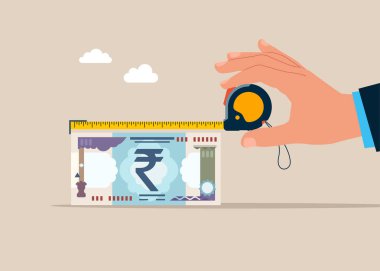 El ele tutuşan şerit ve banknotun uzunluğunu ölçer. Yatırım, servet, harcama, enflasyon ve tasarruf kaybı kavramı. Para bir mezura ile ölçüldü.