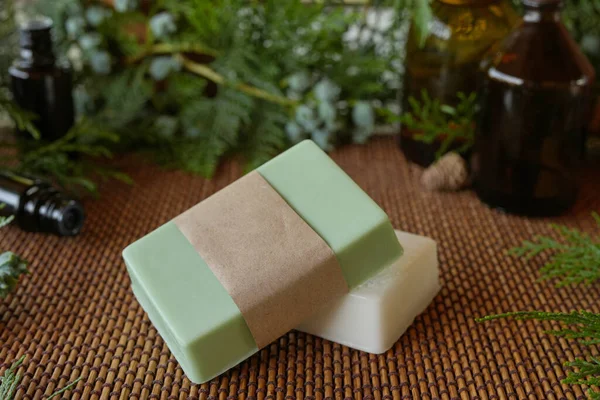 Natural handmade soap on a wooden background. Spa-natural treatments.Natural organic soap from scratch with pine aroma, essential oils. Seasonal pine handmade soap. Side view.