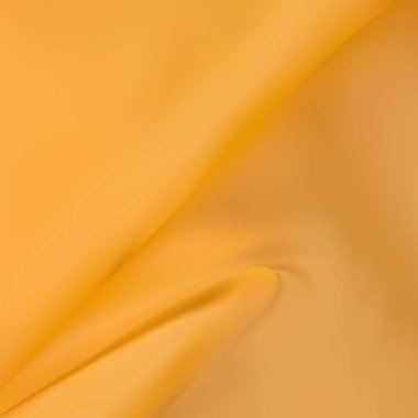 Kırışık sarı mikrofiber kumaş. Bir paçavranın dokusu yakın plan