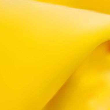 Soyut lüks kumaş, kırışık çarşaf ve sarı gölgeler gibi bulanık kıvrımlar.