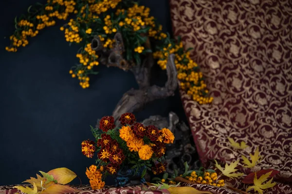 Autumn flowers. Floristics. Composition of autumn flowers, berries, leaves.