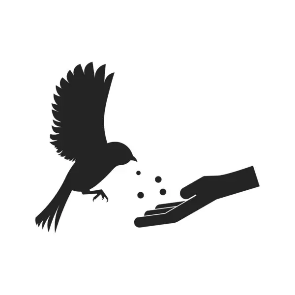 Hayvanları beslemek için izole edilmiş yasak işareti, uçan kuş ve el ile kırmızı işaretli yuvarlak bir yiyecek verin.