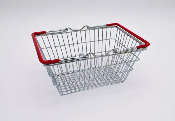 stock image Photo of an empty silver metal wire shopping basket with red handles 