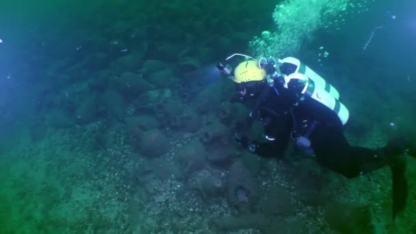 Underwater Archeology Explorer Diver Slowly Swims Mountain Amphorae Representing Antique — Video