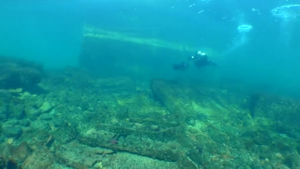 Diver Underwater Scooter Swims Background Concrete Hydraulic Structure Leaves Frame — Video
