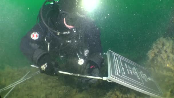 Underwater Cultural Heritage Deck Wreck Submarine Diver Preparing Install Sign — Stock video