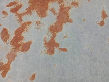 Metal levha yüzeyindeki pas dokusu. Endüstriyel kökenli doku.