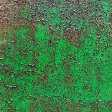 Pek çok çatlakla kaplı metal bir yüzey üzerinde eski zehirli yeşil boya ile parlak bir arka plan..