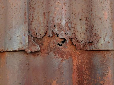 Çürümüş eski bir metal levhanın arka planı. Eski metal kaplama. Çürük metalli doku.