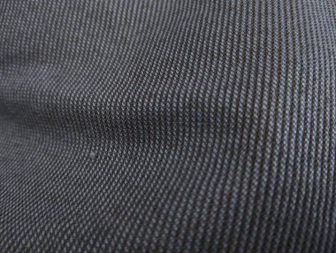 Siyah keten kumaş dokusunun makro çekimi.