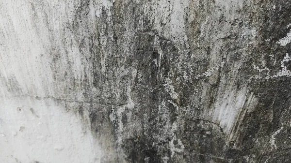 Siyah beyaz resimli kirli bir duvar.