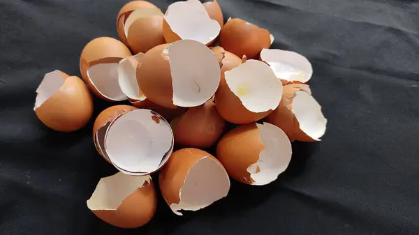 a pile of eggs with a broken shell