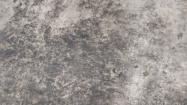 texture of a concrete wall with cracks and scratches which can be used as a background