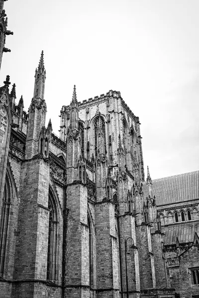 stock image Black and white photo of a Gothic cathedral with intricate stone carvings and tall spires.