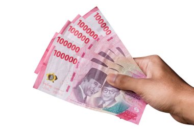 El ele tutuşan IDR 100.000 rupiah notu beyaz arka planda izole edildi. finans ve finans kavramı