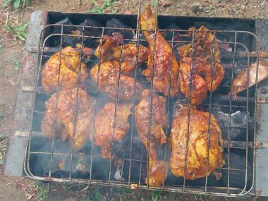 chicken legs in the grill 