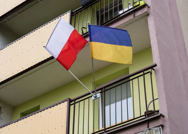 Flag of Ukraine and Poland on the balcony of an apartment building