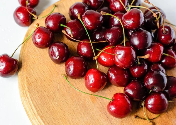 stock image Juicy sweet cherry on old wooden background