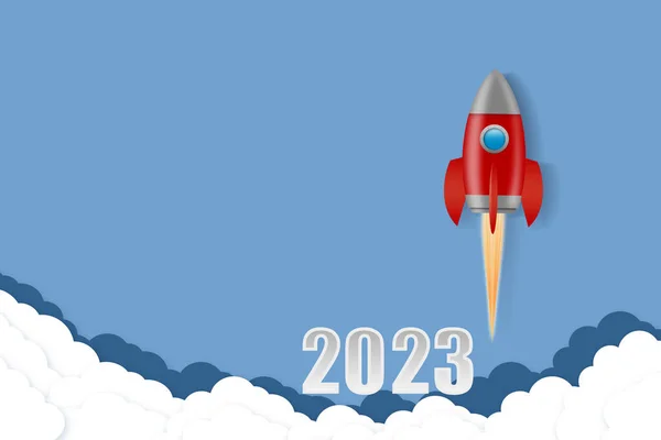 2023. Numbers and space rocket, and clouds on a blue background. New Year concept.Business. Festive background.