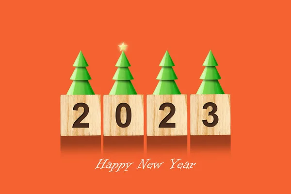 2023, numbers on wooden blocks, Christmas trees with a star.Bright orange background. New Year card. Christmas background. Festive background.