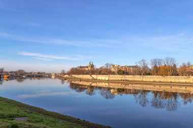Krakow. Poland. Beautiful embankment of the Vistula River, with beautiful bridges. Sunny day. Sights of Krakow. Europe.