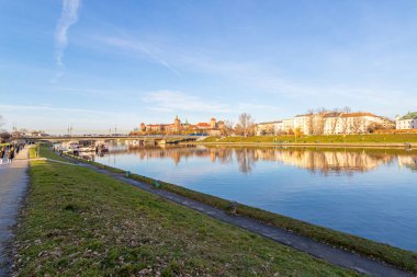 Krakow. Poland. Beautiful embankment of the Vistula River, with beautiful bridges. Sunny day. Sights of Krakow. Europe.
