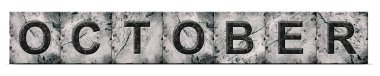 October, word on an alphabet on stone blocks, isolated on white background. Month of the year concept. Background.