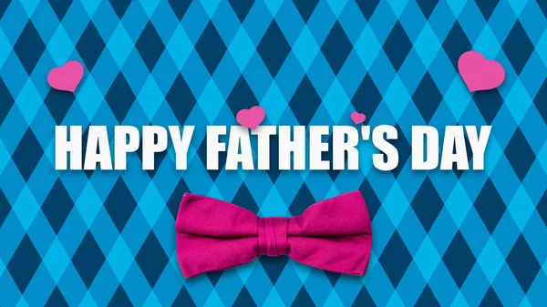 Happy Fathers Day. Red Bow Tie, and words on a Blue, striped background. Fathers Day Concept. Festive background. Background.