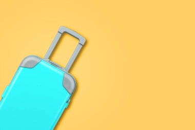 Mavi bavul. Sarı arka planda. Uzayı kopyala Seyahat geçmişi. Seyahatler. Seyahat için arka plan .