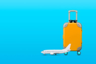 Seyahat konsepti. Mavi arka planda turuncu seyahat valizi ve uçak. Uzayı kopyala Seyahat arkaplanı.