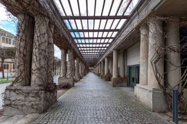 Pergola - concrete arch passage in the garden, tourist attraction of Wroclaw, Poland. clipart