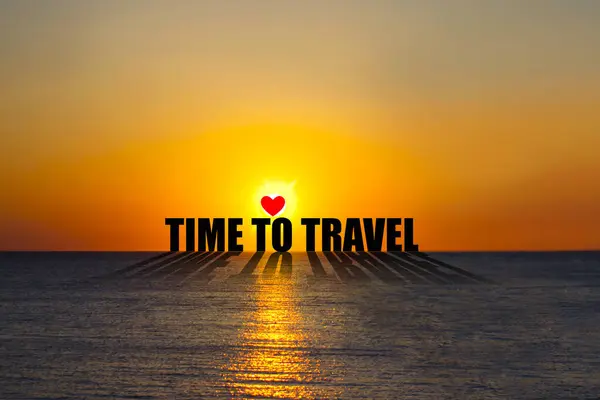 Time to Travel. Word on the background of the sunset over the ocean. Lifestyle. Background