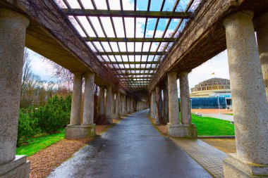 Pergola - concrete arch passage in the garden, tourist attraction of Wroclaw, Poland. clipart