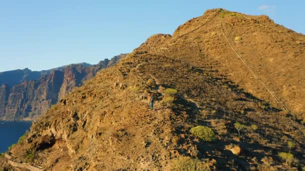 Aerial Man Silhouette Climbing Mountain Amazing Sunset Backpacker Explores Volcanic — Vídeos de Stock
