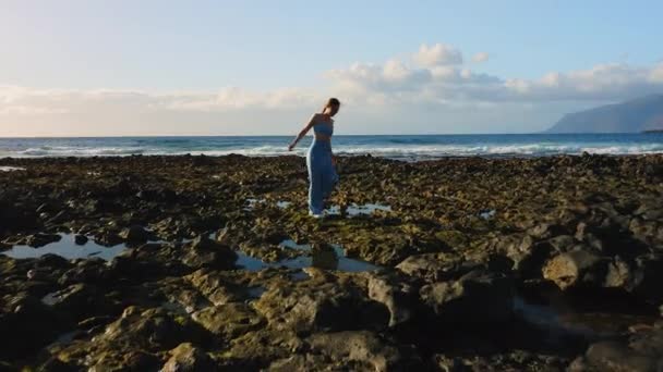 Woman Walking Volcanic Rocky Beach Explore World Aerial View Lonely — Stockvideo