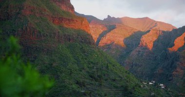 Spring landscape with village and green mountains at sunset lights. Masca gorge. Tenerife, Canary Islands.