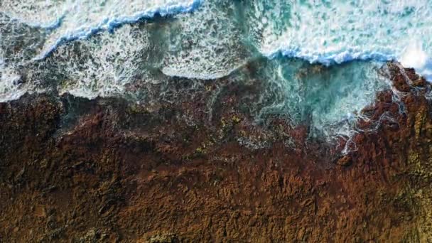 Aerial Top View Waves Break Rocky Volcanic Pristine Beach Sea — Video Stock