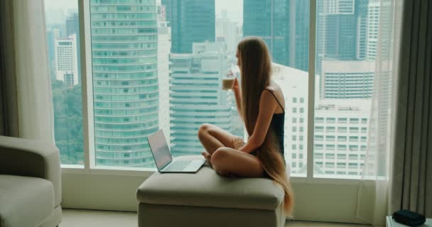 Woman Sits Comfortably Wide Window Cup Coffee Hand While Working — Stockvideo
