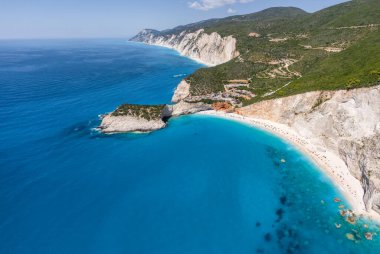 Aerial panoramic shots of famous tourist location of paradise beach in Lefkada, Greece. Porto Katsiki legendary cliffs and views of breathtaking seascapes. clipart