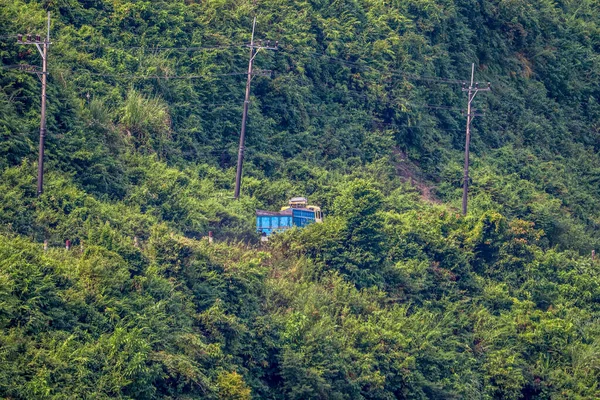 Teknaf, Bangladesh - November 7th 2019-Truck crossing through green mountains. Landscape shots